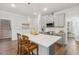 Bright kitchen featuring stainless appliances, a kitchen island and pendant lighting at 190 Salem Village Dr, Fuquay Varina, NC 27526