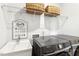 Functional laundry room with a utility sink, modern washer and dryer, and ample storage at 190 Salem Village Dr, Fuquay Varina, NC 27526