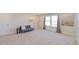 Bright living room with large windows, carpeted floors and natural light at 190 Salem Village Dr, Fuquay Varina, NC 27526