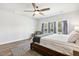 Bright main bedroom with large windows, wood accents, and a serene atmosphere at 190 Salem Village Dr, Fuquay Varina, NC 27526