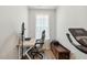 Functional home office with a bright window, desk setup, and workout equipment at 190 Salem Village Dr, Fuquay Varina, NC 27526