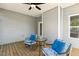Enjoy outdoor relaxation on this covered porch, complete with comfortable seating and charming decor at 190 Salem Village Dr, Fuquay Varina, NC 27526