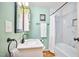 Bright bathroom with modern fixtures, a marble-tiled shower, and stylish decor at 1921 Clark Ave # 105, Raleigh, NC 27605