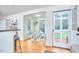 Charming breakfast nook with natural light, hardwood floors, and access to the outdoors at 1921 Clark Ave # 105, Raleigh, NC 27605