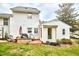 Exterior view of the home with a patio, grill, and lush backyard at 1921 Clark Ave # 105, Raleigh, NC 27605