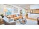Inviting living room featuring stylish furniture, hardwood floors, and a view of the kitchen at 1921 Clark Ave # 105, Raleigh, NC 27605