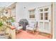 Outdoor patio area featuring comfortable seating, a grill, and a cozy ambiance at 1921 Clark Ave # 105, Raleigh, NC 27605