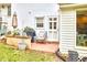 Cozy patio with a grill and comfortable seating, perfect for outdoor relaxation at 1921 Clark Ave # 105, Raleigh, NC 27605