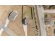 Aerial view of a home with a large yard, long driveway, and nearby road at 20 W Park Ln, Sanford, NC 27332