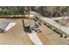 Aerial view of a home with a long driveway, a large yard, and a two car garage at 20 W Park Ln, Sanford, NC 27332