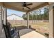 Spacious backyard with a covered patio, privacy fence, and mature trees at 20 W Park Ln, Sanford, NC 27332