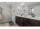 Bathroom featuring double sink vanity with dark cabinets and a separate shower area at 20 W Park Ln, Sanford, NC 27332