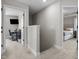 Upstairs hallway leading to bedrooms with neutral paint and carpet at 20 W Park Ln, Sanford, NC 27332