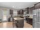 Updated kitchen with granite countertops, stainless steel appliances, and a central island at 20 W Park Ln, Sanford, NC 27332