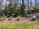 Well maintained backyard featuring a bird bath, bench, and fence at 2005 Bridgeport Dr, Raleigh, NC 27615