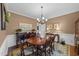 Traditional dining room features a wooden table, chandelier, and elegant decor at 2005 Bridgeport Dr, Raleigh, NC 27615