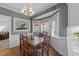 Inviting dining area with hardwood floors, bay window, and decorative chandelier, perfect for gatherings at 2005 Bridgeport Dr, Raleigh, NC 27615