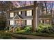 Charming two-story home with gray siding, black shutters, front porch, and landscaped yard at 2005 Bridgeport Dr, Raleigh, NC 27615