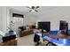 Bright office with a couch, desk, computer monitor, and ceiling fan at 2005 Bridgeport Dr, Raleigh, NC 27615