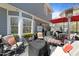 Cozy outdoor patio with ample seating, fire pit, and an umbrella at 2005 Bridgeport Dr, Raleigh, NC 27615