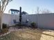 Private backyard with stone patio, outdoor seating, and a fenced perimeter at 2036 Big Falls Dr, Wendell, NC 27591
