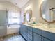 Elegant bathroom with double vanity, soaking tub, and a separate glass-enclosed shower at 2036 Big Falls Dr, Wendell, NC 27591
