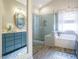 Beautiful bathroom with a double vanity, soaking tub, and a glass-enclosed shower at 2036 Big Falls Dr, Wendell, NC 27591