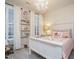 Charming bedroom with hardwood floors, a chandelier, and built in shelves at 2036 Big Falls Dr, Wendell, NC 27591