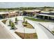 Aerial view of mixed use development with beautifully landscaped walkways, trees and modern architecture at 2036 Big Falls Dr, Wendell, NC 27591