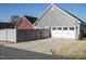 Exterior shot of two-story home with a two car garage, fenced yard and driveway at 2036 Big Falls Dr, Wendell, NC 27591