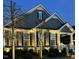 Charming home exterior featuring neutral siding, manicured landscaping, and inviting lighting for a warm ambiance at 2036 Big Falls Dr, Wendell, NC 27591
