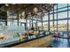 Stylish interior view of bar with wood accents, modern lighting, and large windows showcasing the outdoor scenery at 2036 Big Falls Dr, Wendell, NC 27591