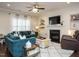 Bright living room with a fireplace, shiplap wall, and comfortable seating at 2036 Big Falls Dr, Wendell, NC 27591
