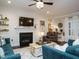Cozy living room with a fireplace, shiplap wall, and comfortable seating at 2036 Big Falls Dr, Wendell, NC 27591
