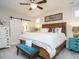 Charming bedroom with shiplap wall, rustic decor, and a sliding barn door to the ensuite at 2036 Big Falls Dr, Wendell, NC 27591