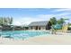 Inviting community pool featuring a slide, water features, and a cozy building with a tin roof at 2036 Big Falls Dr, Wendell, NC 27591