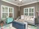 Relaxing porch featuring a swing bed, ceiling fan, and neutral furniture at 2036 Big Falls Dr, Wendell, NC 27591