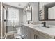 Stylish bathroom with double vanity, tile backsplash, and a glass-enclosed shower at 209 Ashmore Ln, Rocky Mount, NC 27804