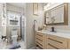 Bathroom featuring a shower, toilet, vanity with marble countertop, and decorative accents at 209 Ashmore Ln, Rocky Mount, NC 27804