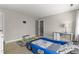 Bright, carpeted bedroom featuring a racecar bed, ' rug, and neutral walls at 209 Ashmore Ln, Rocky Mount, NC 27804