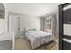 Cozy bedroom with natural light, neutral colors, and a comfortable bed at 209 Ashmore Ln, Rocky Mount, NC 27804