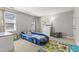 Bright bedroom with a fun racecar-themed bed, and a decorative area rug at 209 Ashmore Ln, Rocky Mount, NC 27804