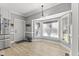 Bright breakfast nook features a bay window, door to outside, and stainless steel refrigerator at 209 Ashmore Ln, Rocky Mount, NC 27804