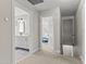Upstairs hallway with access to bedrooms, bathroom, and staircase to lower level at 209 Ashmore Ln, Rocky Mount, NC 27804