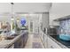 Bright, modern kitchen features a large island with blue stools and plenty of counter space at 209 Ashmore Ln, Rocky Mount, NC 27804