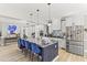 Modern kitchen with granite countertops, a large island with bar seating, and stainless-steel appliances at 209 Ashmore Ln, Rocky Mount, NC 27804
