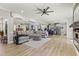 Open-concept living room with hardwood floors flowing into the gourmet kitchen and dining area at 209 Ashmore Ln, Rocky Mount, NC 27804