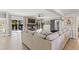 Comfortable living area featuring a large sectional sofa and access to the backyard deck at 209 Ashmore Ln, Rocky Mount, NC 27804