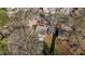 An aerial view of the property, showing the backyard, driveway and surrounding greenery at 211 W Sycamore, Zebulon, NC 27597