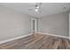 Spacious bedroom with wood floors, ceiling fan and a large closet at 211 W Sycamore, Zebulon, NC 27597